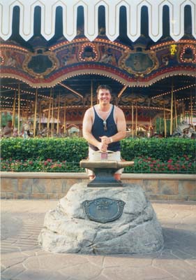 Me at Disney World with the Sword in the Stone prop
